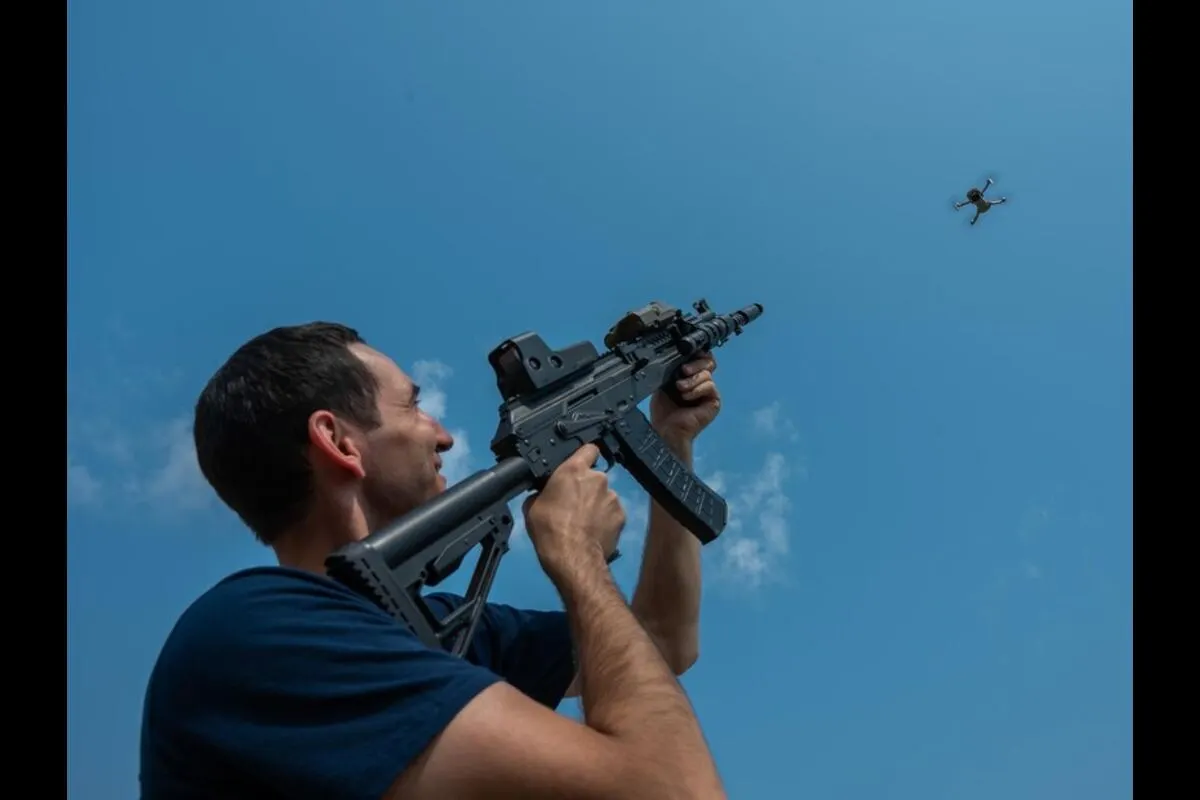 A person aiming a gun at a drone flying overhead, representing the act of shooting down a drone.